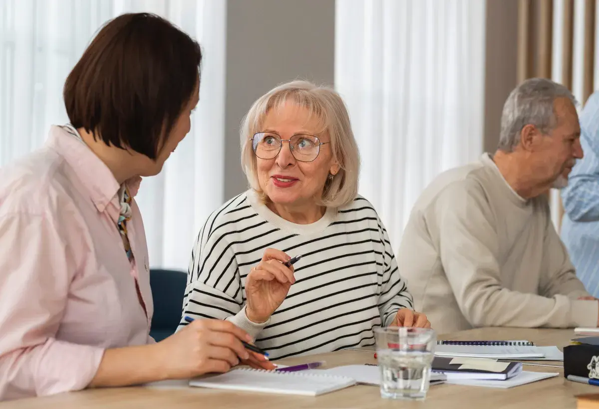 seniors discussing the good news of an aging policy 