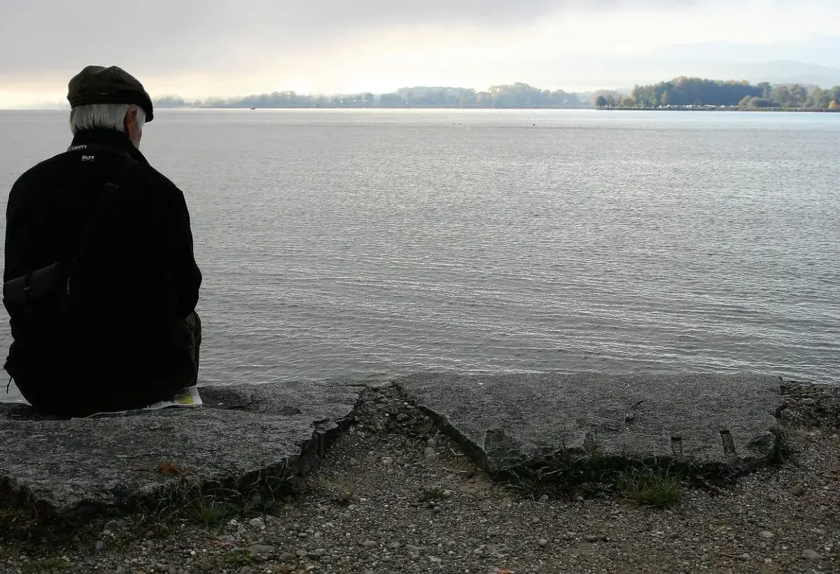 old man by the sea, watching a darker horizon