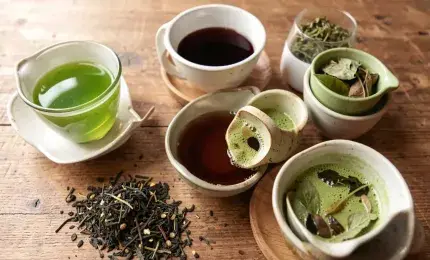Assorted tea varieties including green tea black tea matcha and herbal tea in cups