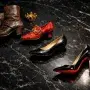 A timeline of heel styles from a sturdy cavalry boot to a sleek red-soled stiletto, symbolizing the rich history and evolution of high heels.
