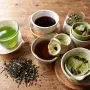 Assorted tea varieties including green tea black tea matcha and herbal tea in cups