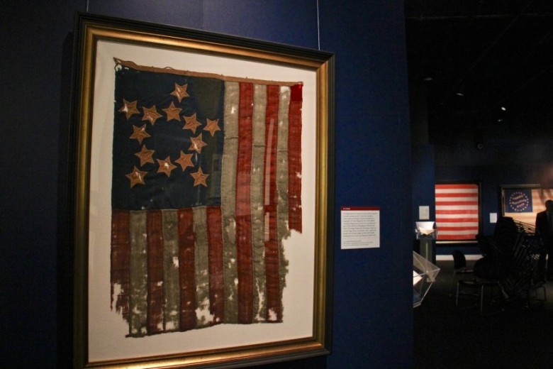 What do the stripes on the American flag represent?