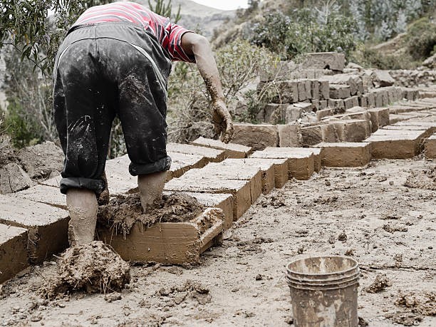 What ancient building material is made from mud and straw?