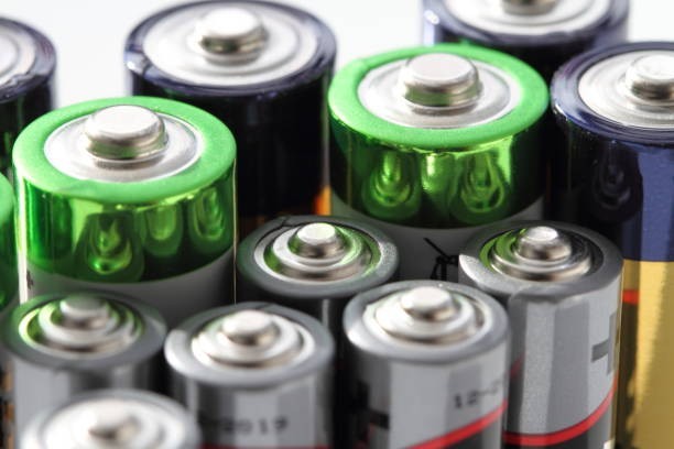 Where should old batteries typically be disposed of?
